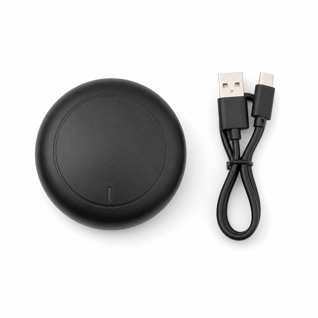GPS kit flatlay — circular GNSS puck and cable